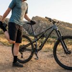 Mountain biker climbing a rugged Denver trail